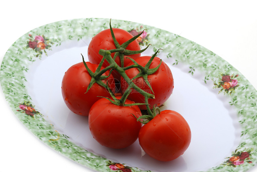 在盘子上隔离的番茄美食植物反射蔬菜叶子收获农业果汁水果小吃图片