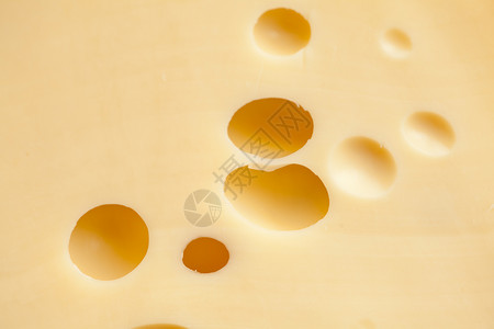 带孔的起司口粮蛴螬食物样本奶制品黄色状况食品乳制品背景图片