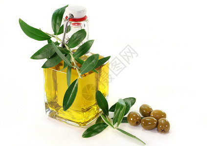 橄榄油油瓶食物绿色金黄色产物美食家冷压橄榄枝背景图片