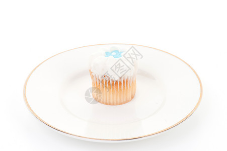 小纸杯蛋糕甜点星星花朵盘子装饰食物蓝色背景图片