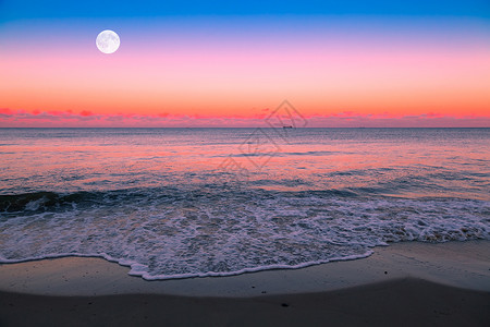 月出紫色月亮海景辉光火焰日落蓝色天空海滩橙子高清图片