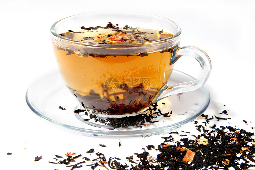 在一个透明的杯子里茶茶草药餐具食物早餐玻璃阴影液体活力盘子花瓣图片