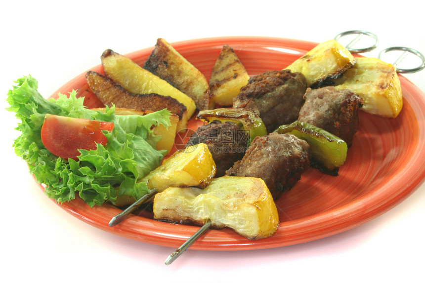 摩洛哥烧烤切片炙烤肉串盘子胡椒蔬菜肉丸沙拉土豆图片