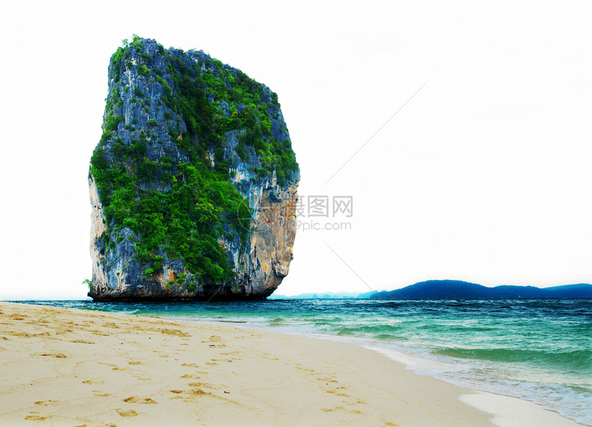 热带岛屿高悬崖支撑气候海滩岩石天空蓝色编队勘探场景海景图片