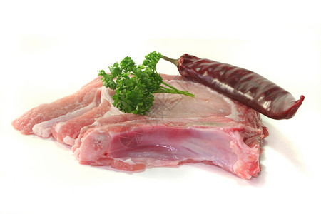 猪排猪肉红色香菜蛋白食物粉色骨头胡椒烹饪背景图片