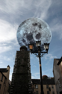 街灯月亮满月的街灯和时钟背景