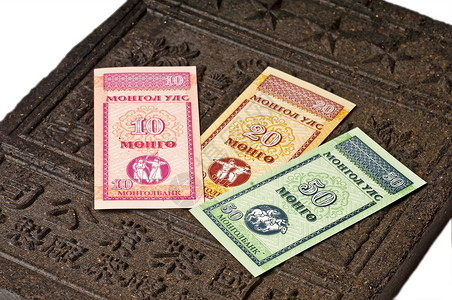 茶砖用蒙古货币出口外国进口现金黑色商务市场背景图片