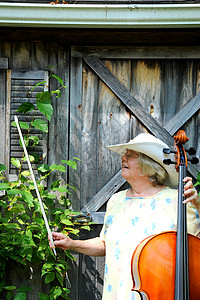 女大提琴手字符串成人声学乐器独奏大提琴音乐音乐家背景图片