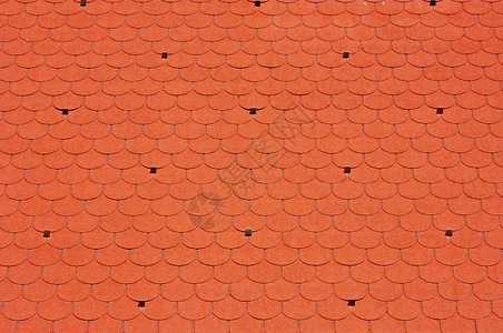 闪线卵石红色沥青屋顶房子材料背景图片