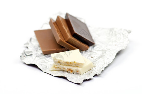 巧克力切片在一块子上挫败甜点糖果瓷砖背景图片