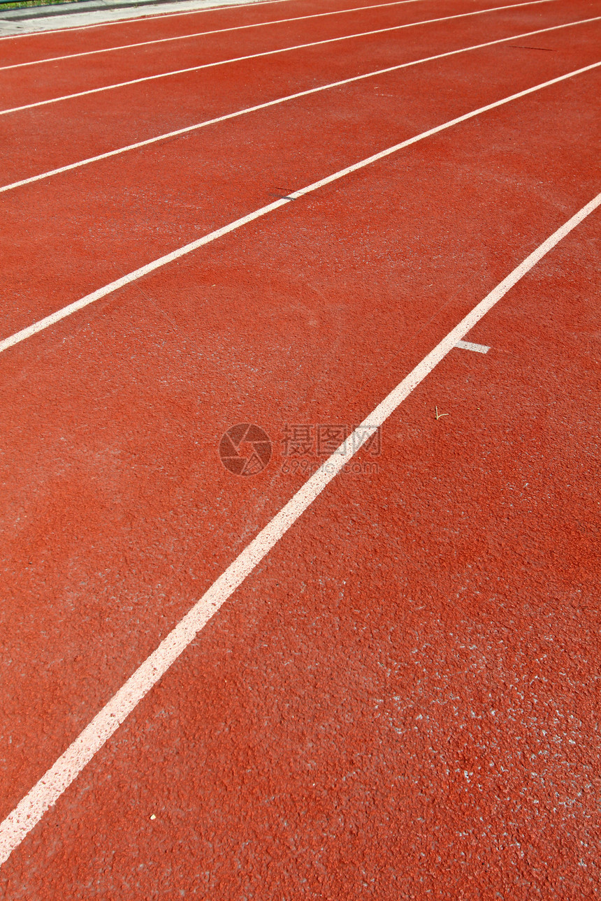 运行轨道竞技场运动员红色曲线体育场地面专注跑步车道竞争图片
