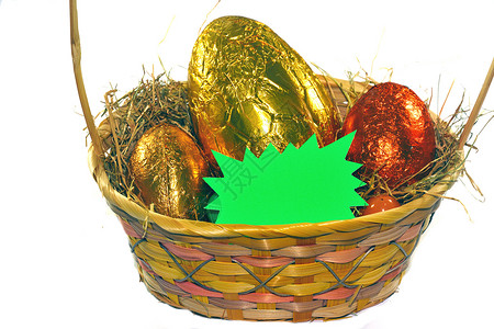 篮子中的复活鸡蛋星星绿色背景图片