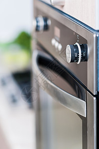 炉子上的控件工作台飞溅烤箱炊具滚刀房子活力气体绿色工作背景图片