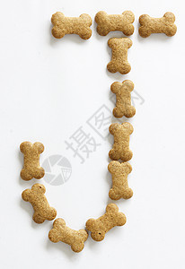 骨形形狗食品形状动物饲料骨骼字母狗骨头棕色背景图片