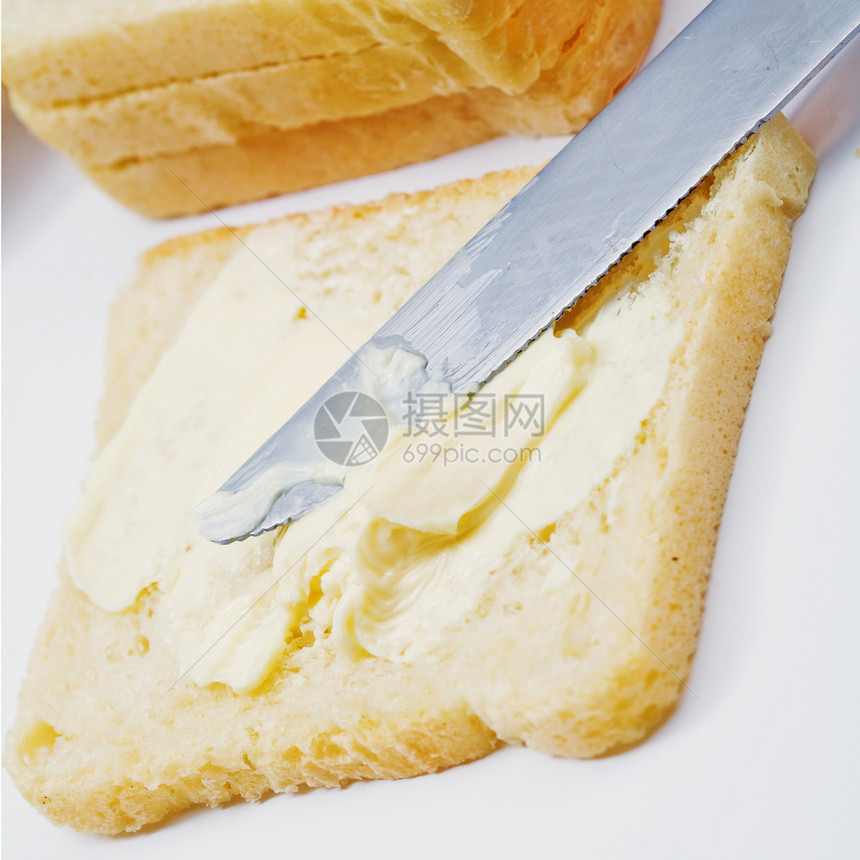 面包上的黄油奶制品杂货黄色健康产品食物金子早餐图片