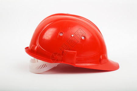 红头盔建造工作头饰红色建筑工作服背景图片