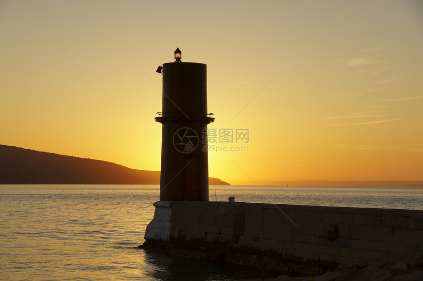 阳光明媚的灯塔晴天太阳红灯笼地方盐水红色天空水岩海域图片