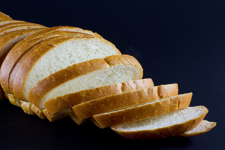 一块面包淀粉化合物酵母碳水黄油食物背景图片