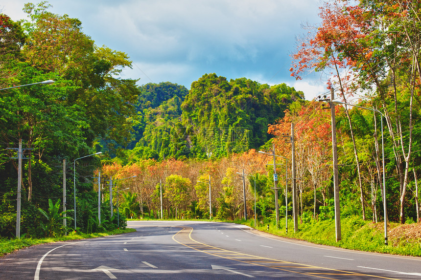 泰国公路网泰国高速公路照片戏剧性悬崖丛林热带荒野土地太阳晴天小路图片