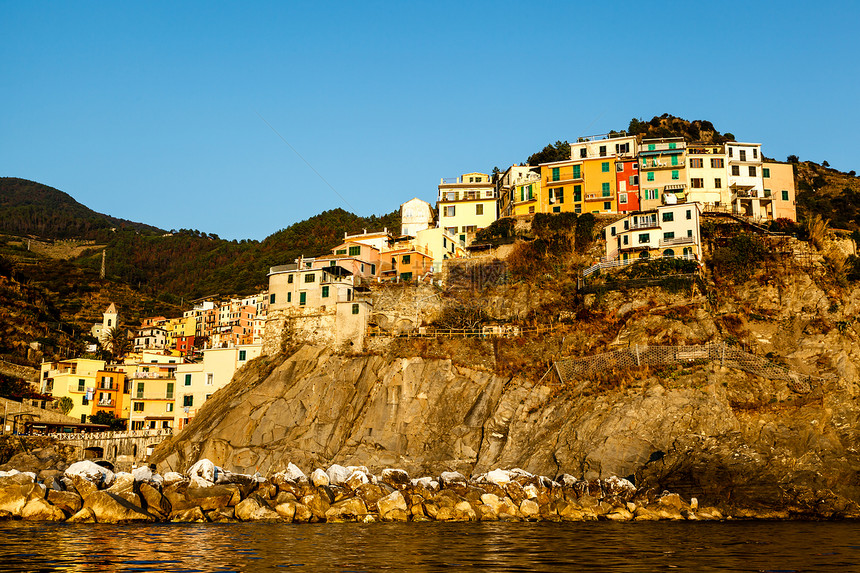 意大利辛克特尔岛马纳罗拉村日落假期天空港口蓝色海滩悬崖建筑学房子海岸线旅行图片