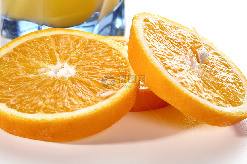 橙子片段和果汁杯玻璃饮料核心石头果汁食物种子水果图片