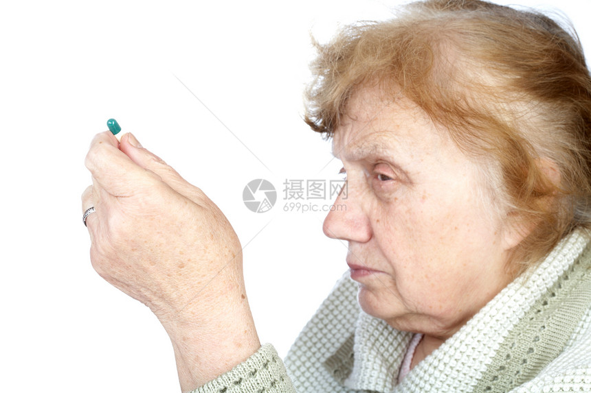 老太婆握在手胶囊里药物祖母疾病女士医学程序胶囊老年药品医疗图片