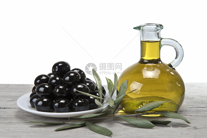黑色橄榄和油的盘子调味品玻璃饮食处女营销烹饪食物叶子营养美食图片