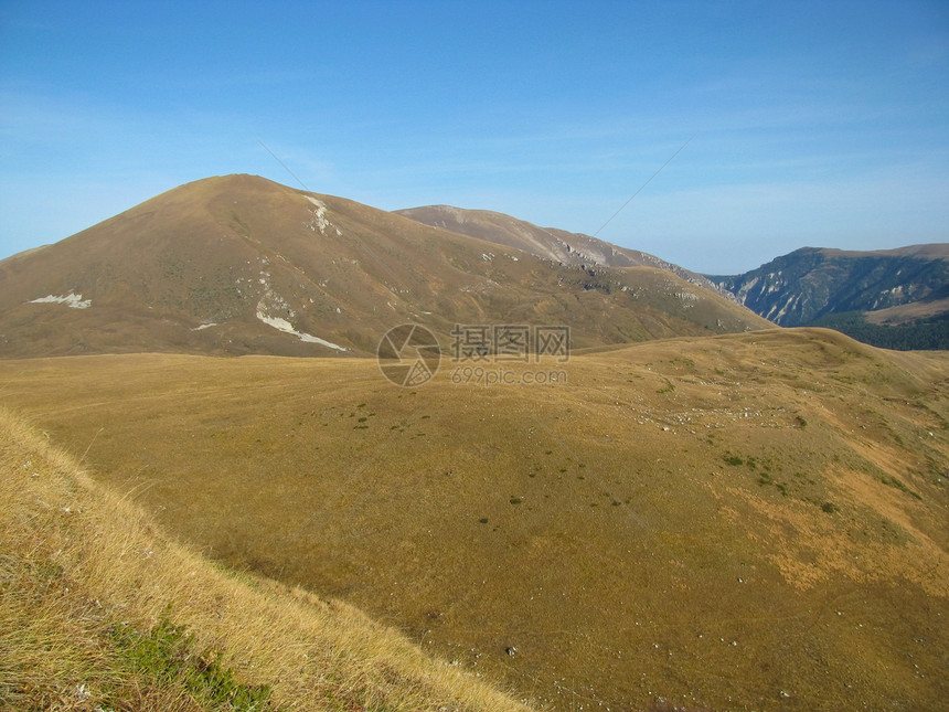 高加索山脉旅游岩石山脉冰川宽慰植物爬坡草甸石头全景图片