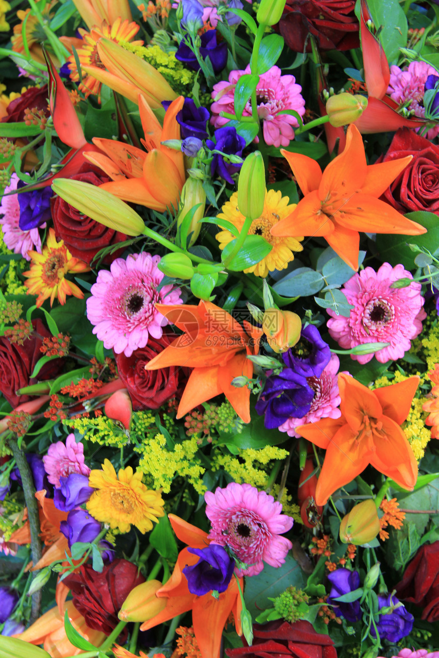 彩色的混合花卉安排玫瑰花朵植物群蓝色橙子花店作品植物学紫色百合图片
