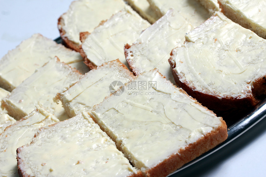 普通黄油面包黄油包子传统食物白色糕点金子棕色脆皮小吃图片