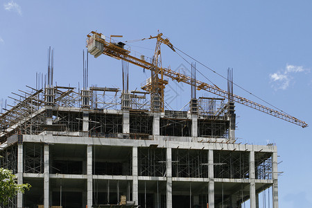 建筑建筑工程天空外观蓝色脚手架起重机工地办公室住宅背景图片
