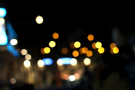城市 bokeh 背景反射夜生活橙子圆形辉光街道黄色旅行场景蓝色背景图片