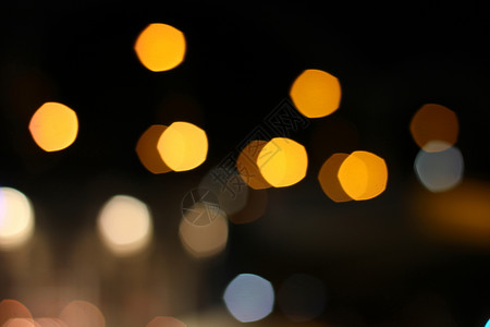 城市 bokeh 背景黄色夜生活辉光反射场景旅行街道橙子蓝色圆形背景图片