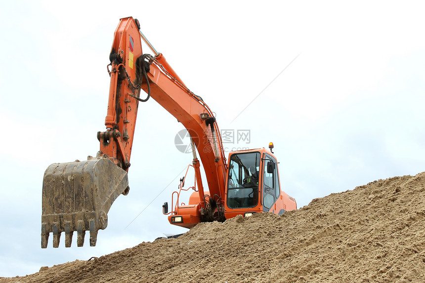 挖掘机工作装载机碎石手臂运动橙子建造沙坑工程建筑推土机图片
