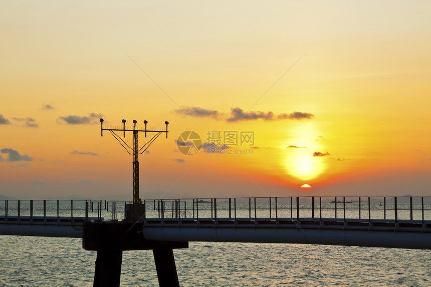 香港机场跑道灯光日落旅行蓝色海岸线太阳地平线假期墙纸反射阳光橙子图片