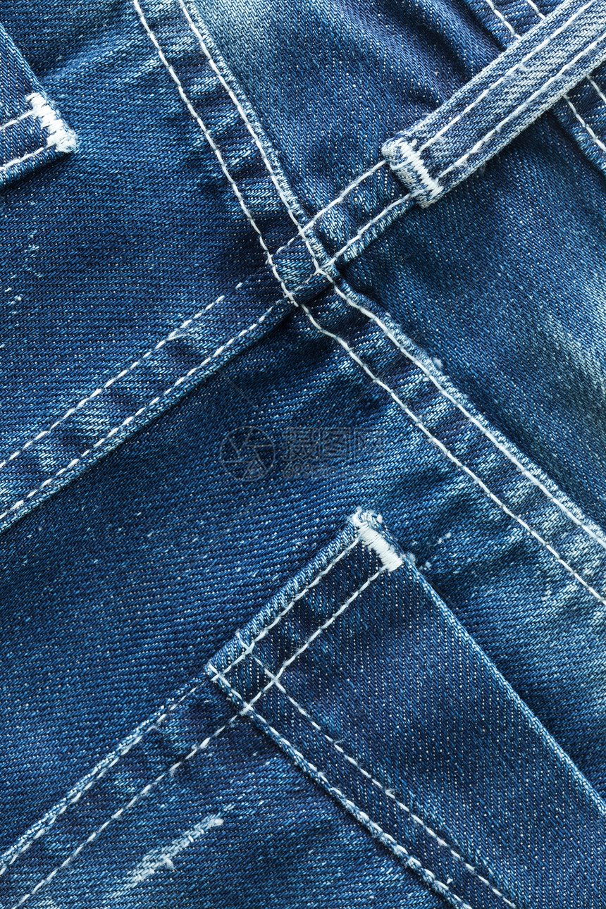蓝牛仔裤口袋式特贴纤维面料裤子材料衣服接缝口袋摄影纺织品棉布图片