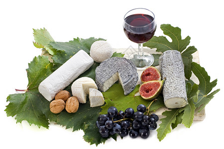 山羊奶酪和水果核桃叶子一杯酒玻璃奶制品食物土特产专业工作室团体背景图片