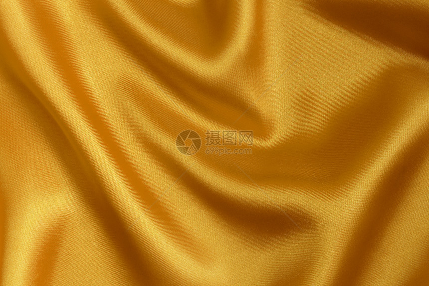 优雅和光滑的金色西边背景奢华窗帘丝绸曲线热情织物海浪纺织品折叠床单图片