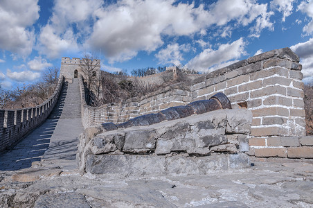 壁垒Mutianyu的长城石头日落地标曲线历史蓝色旅行文化天空场景背景