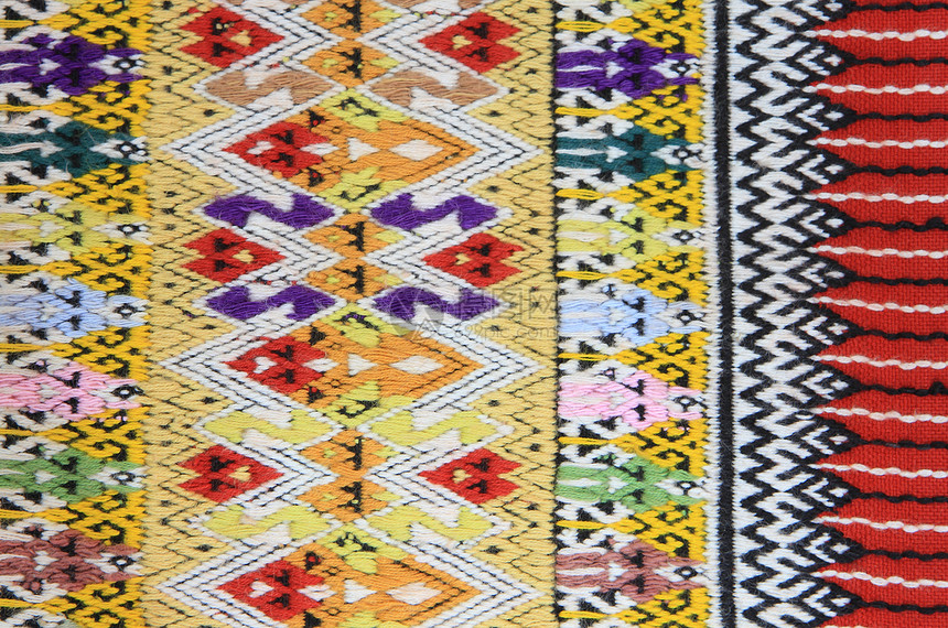 手工编织的泰文风格织布贴近纹理织物丝绸墙纸色调传统染料棉布衣服民间纺织品图片
