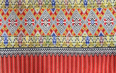 手工编织的泰文风格织布贴近纹理色调染料棉布丝绸纺织品墙纸传统织物民间衣服背景