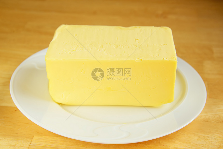 盘子上的黄油生产黄色桌子公克食物白色农业棕色产品牛奶图片