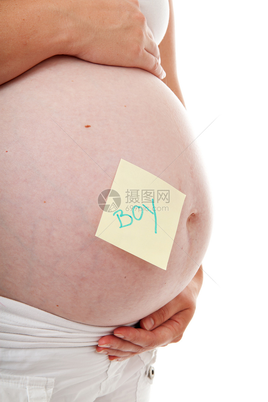 孕妇肚子上粘黏的纸条笔记怀孕母亲婴儿母性男生白色邮政备忘录图片