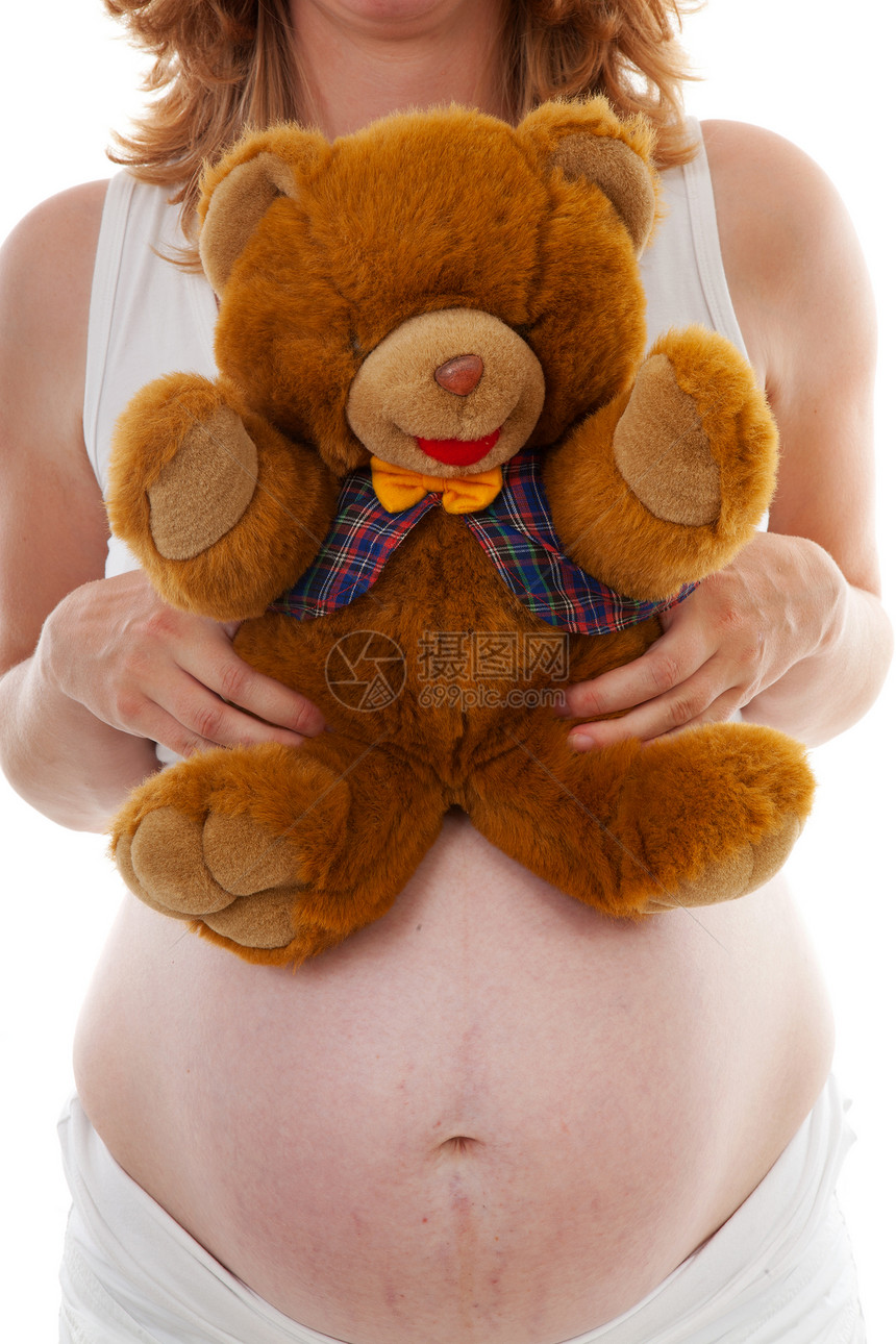 怀着泰迪熊怀孕肚子白色玩具母性母亲婴儿图片