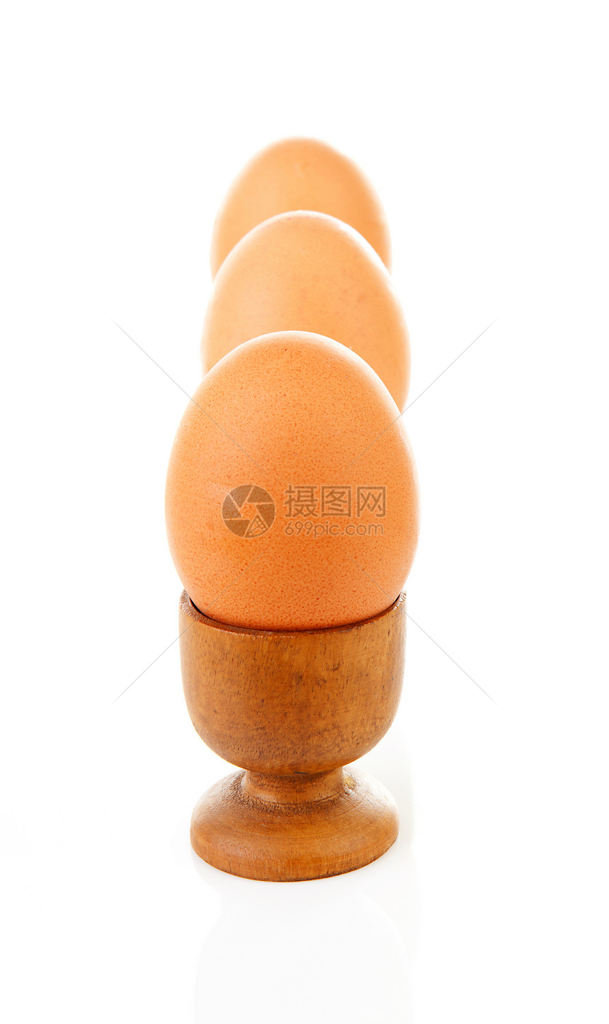 三只鸡蛋装在木袋里午餐棕色早餐蛋壳营养食物木头图片
