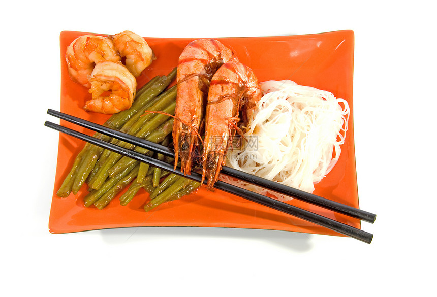 橙盘上的东方餐烹饪盘子豆子橙子筷子食物图片