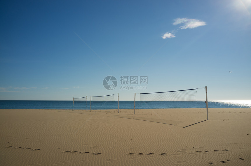 海滩排运动闲暇沙滩晴天阳光排球娱乐水平休闲海洋图片