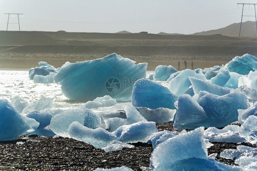 冰山被波浪打碎海滩冰川海洋冻结蓝色水晶海岸线海岸天空冷藏图片