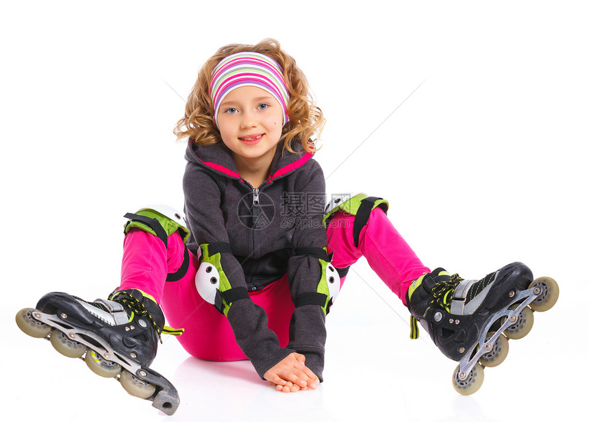 穿溜冰鞋的可爱女孩青年头盔孩子乐趣护膝娱乐滑冰微笑童年运动图片