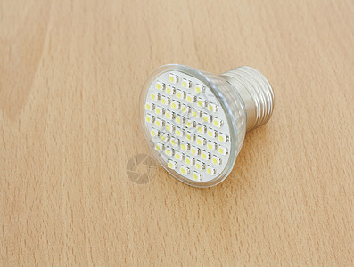 LED灯泡技术白色经济生态照明活力电气玻璃发射木头背景图片